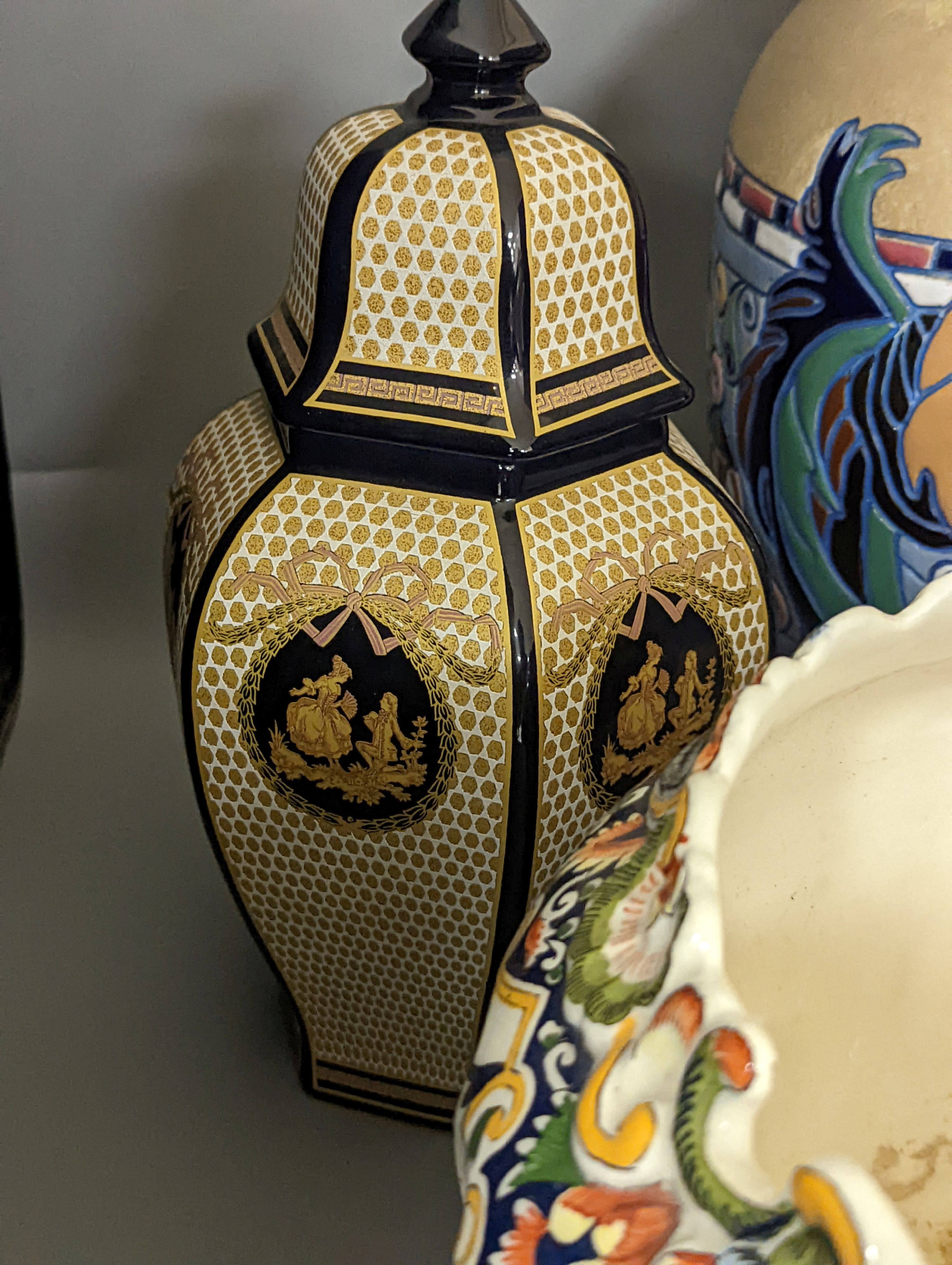 A Mont Saint Michael jardiniere, a lidded jar, two vases and an Amphora chicken decorated vase, Amphora vase 36 cms high.